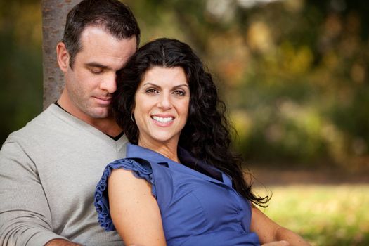 A happy married couple relaxing in the park