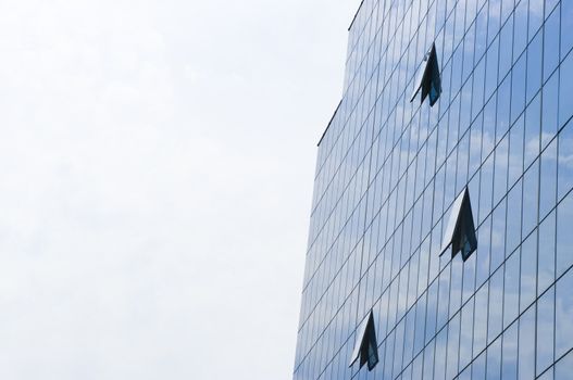 Modern business glass building with three windows