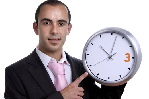A handsome business man holding a clock