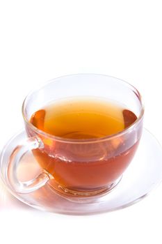 A transparent cup of tea on white background