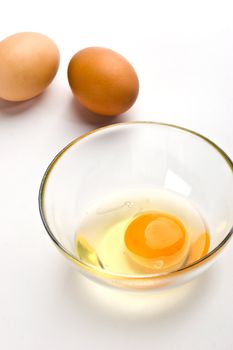 food serias: two hen's eggs and broked one