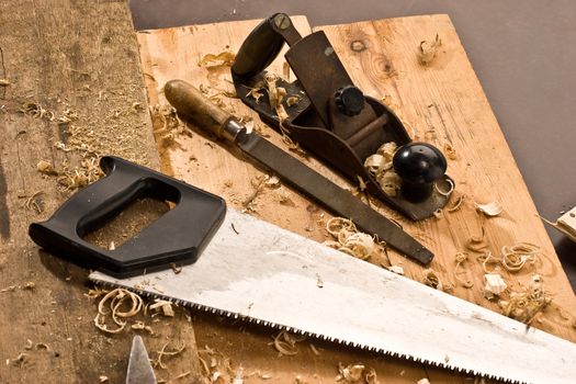 set of carpenters tool on tne wood and shavings