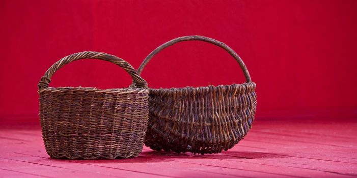 two empty basket on the red background