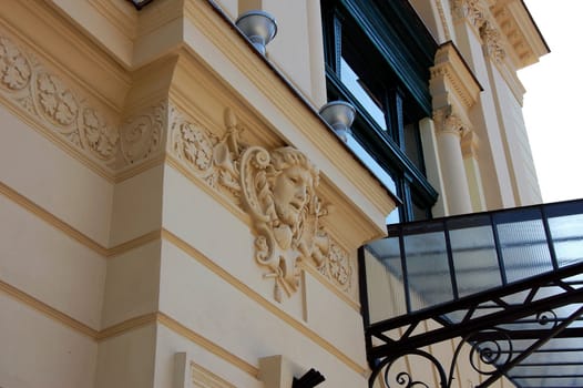 yellow wall sculpture on building in Poland