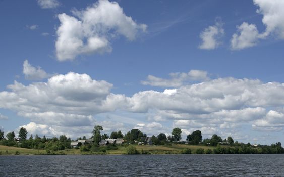 Landscape with a coast of river in a summer day