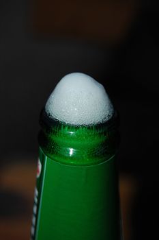 beer foam in the green bottle