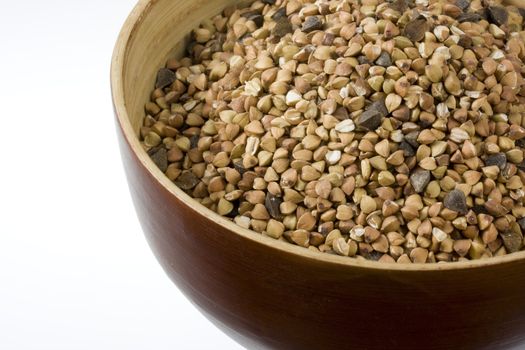 a wooden bowl of buckwheat (kasha), toasted whole grain, white copy space