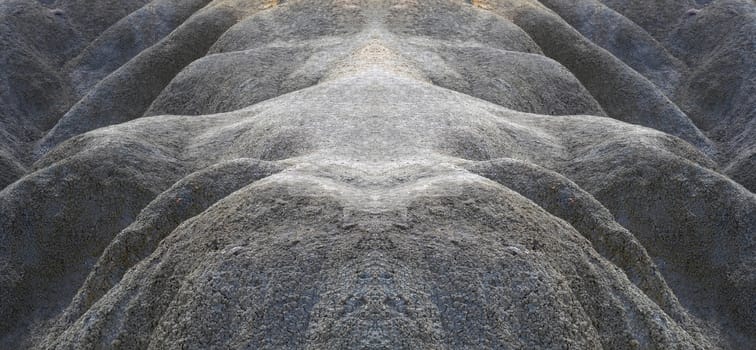 Symmetrical image of clay slope dunes in Malta