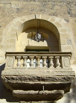Little baroque and medieval balcony reminescent of the Shakespearian novel. This balcony is found in the old city of Mdina, Malta 