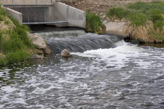 Processed and cleaned sewage flowing out from water reclamation facility to a river