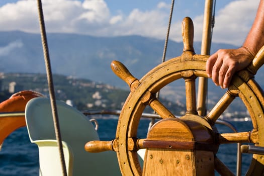 sea theme: steering wheel of yacht at leisure