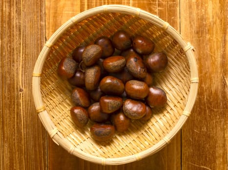 close up of a basket of roasted chestnuts