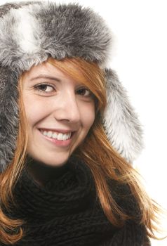 young happy redhead woman with a winter cap on white background