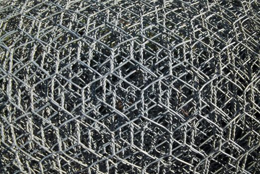background image of rolls of metal wire mesh