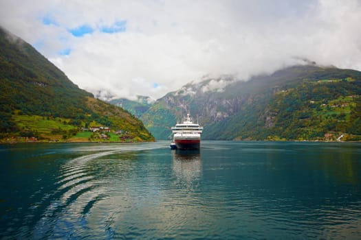 The Geiranger fjord in Norway, surrounded by high mountains