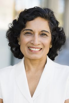 Portrait of a Smiling Indian Businesswoman Looking Directly To Camera