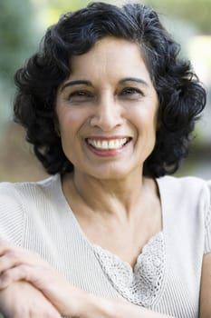 Portrait of a Smiling Mature Indian Woman Looking Directly To Camera