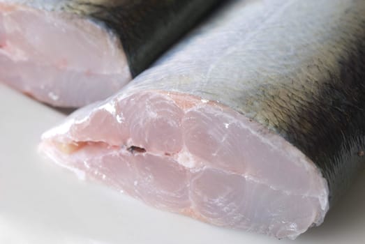 A fresh fish sliced in half ready for filleting