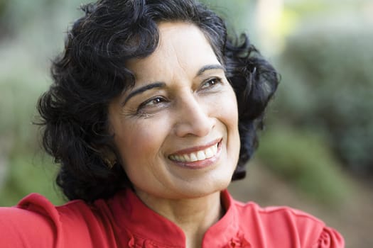 Portrait of a Smiling Mature Indian Woman Looking Away From Camera