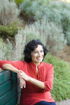 Portrait of a Mature Indian Woman Sitting on a Park Bench