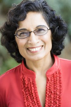 Portrait of a Smiling Mature Indian Woman Looking Directly To Camera