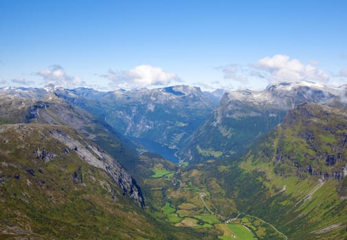 The Geiranger fjord in Norway, surrounded by high mountains