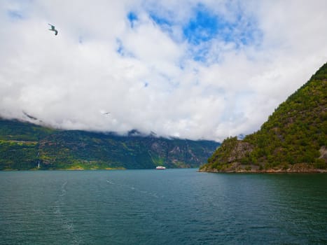 The Geiranger fjord in Norway, surrounded by high mountains