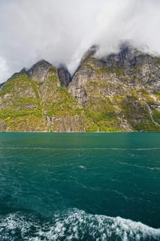 The Geiranger fjord in Norway, surrounded by high mountains