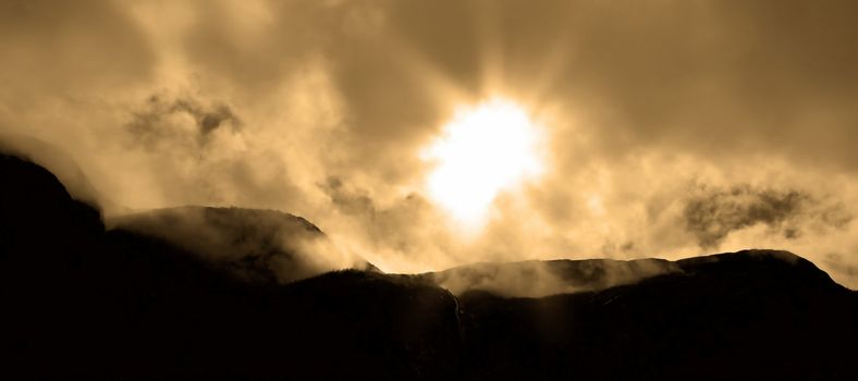 Dramatic skies and mountain range at Geiranger, Norway