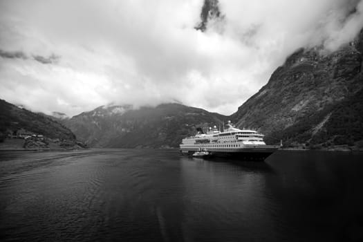 The Geiranger fjord in Norway, surrounded by high mountains