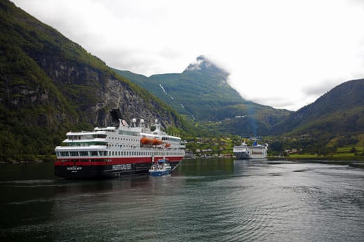 The Geiranger fjord in Norway, surrounded by high mountains