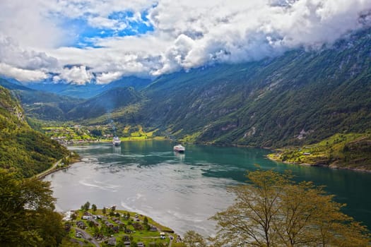 The Geiranger fjord in Norway, surrounded by high mountains