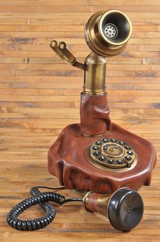 isolated old-fashioned phone on bamboo background