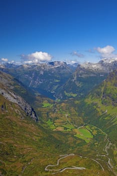 The Geiranger fjord in Norway, surrounded by high mountains