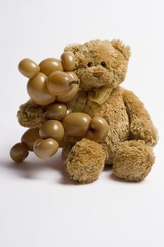 a teddy bear and a balloon bear holding each other like good friend