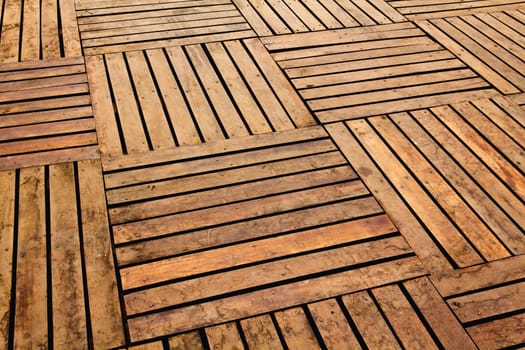 Patterns and textures of a wooden planks pavement