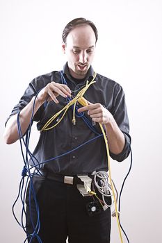 Electronic technician doing a very dangerous connection
