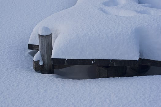 wooden dock cover with snow