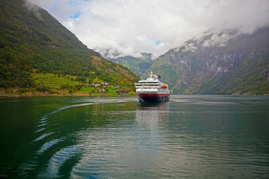 The Geiranger fjord in Norway, surrounded by high mountains