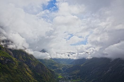 Dramatic skies and mountain range at Geiranger, Norway