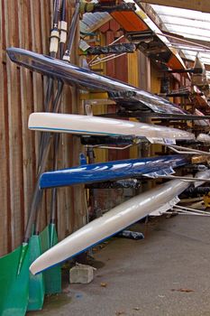 Quad sculls stacked in a boathouse