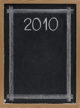 2010 handwritten with white chalk on blackboard with copy space below