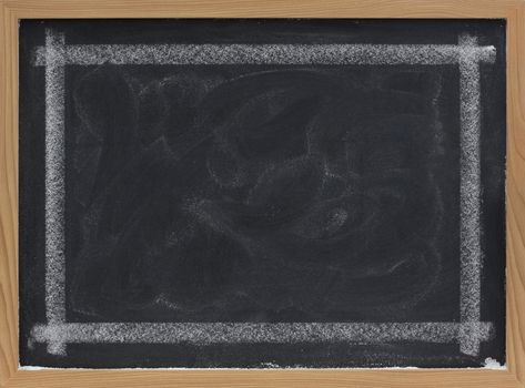blank blackboard with eraser smudges and thick white chalk line frame