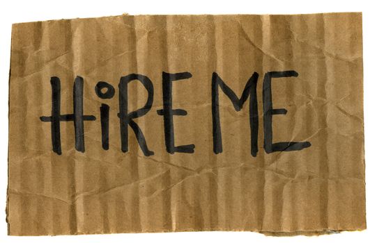 hire me - rough crumpled cardboard sign isolated on white