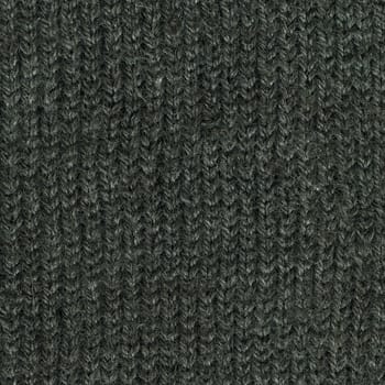 close-up of dark gray handmade knitted sweater texture, wool with acrylic fiber