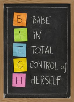 bitch - babe in total control of herself, humorous acronym on blackboard, colorful sticky notes and white chalk handwriting