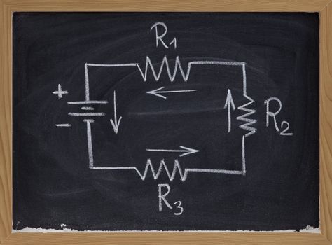 simple schematic of series electric circuit with four resistors and battery cell sketched with white chalk on blackboard