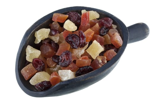 healthy snack - dried cranberries, papaya and pineapple fruit on a rustic wooden scoop isolated on white