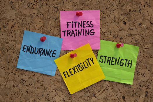 endurance, flexibility, strangth - fitness training goals concept, color sticky notes on cork bulleting board