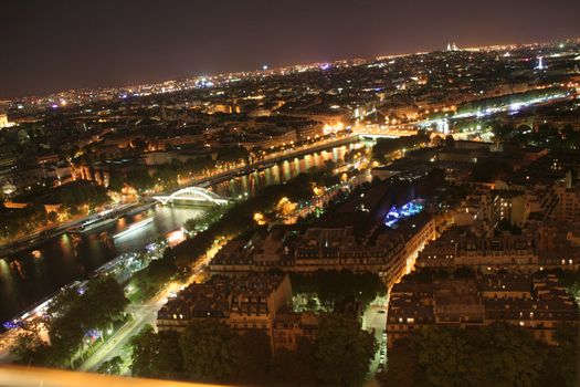 Houses on the streets of the capital of France � Paris. Night view from the Eiffel Tower